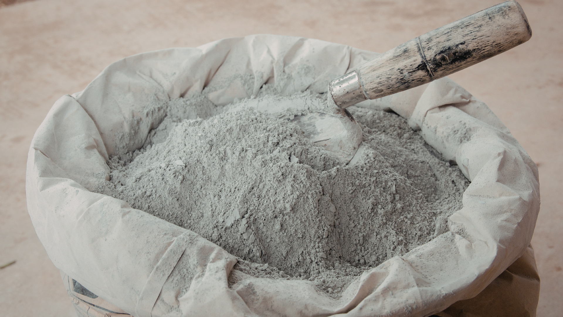 Pozzolanic, such as MetaMax from KaMin can be used to accelerate strength and lower carbon footprint